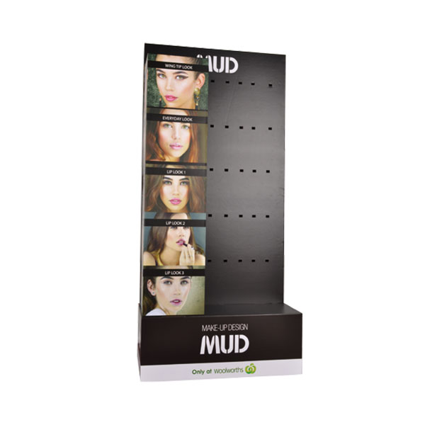 Cardboard retail display stands with pegs for cosmetics